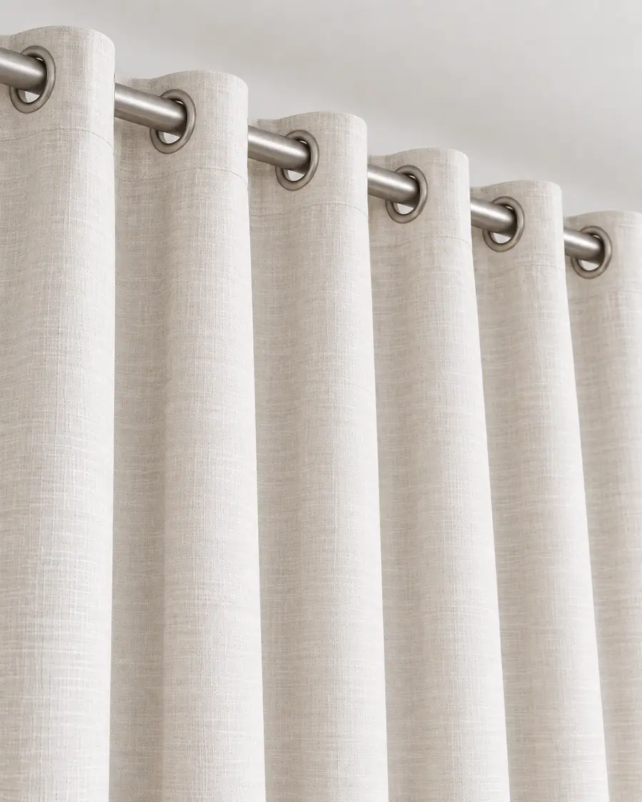 Eyelet and grommet curtain heading
